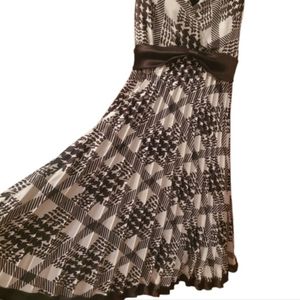 Rabbit Rabbit Rabbit brown and beige sleeveless dress with accordion skirt.